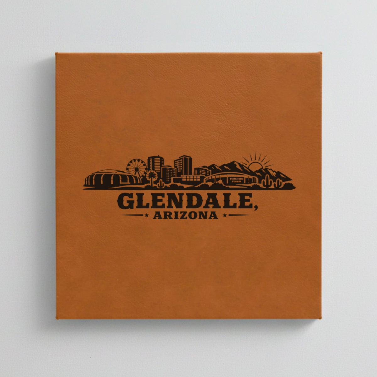 Close up of the Glendale, Arizona skyline engraved on Brown leatherette
