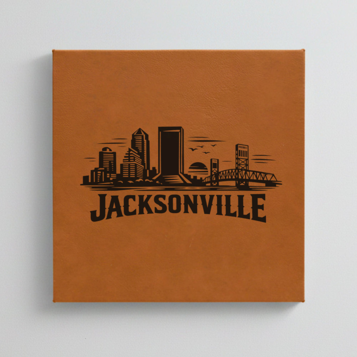 Close up of the Jacksonville, Florida skyline engraved on Brown leatherette