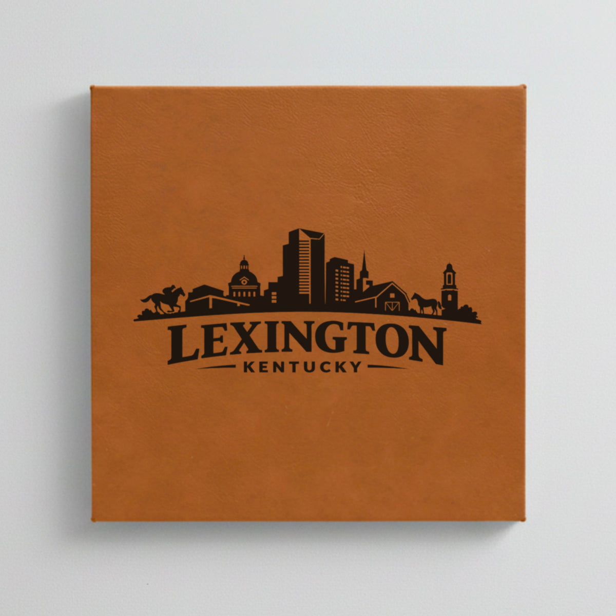 Close up of the Lexington, Kentucky skyline engraved on Brown leatherette
