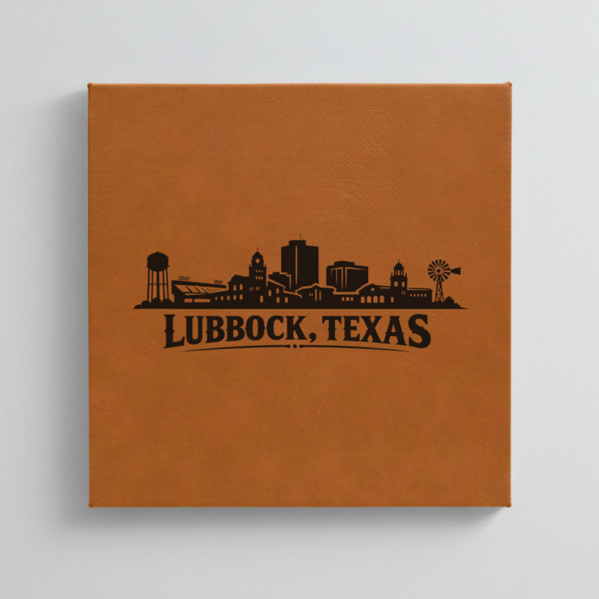 Close up of the Lubbock, Texas skyline engraved on Brown leatherette