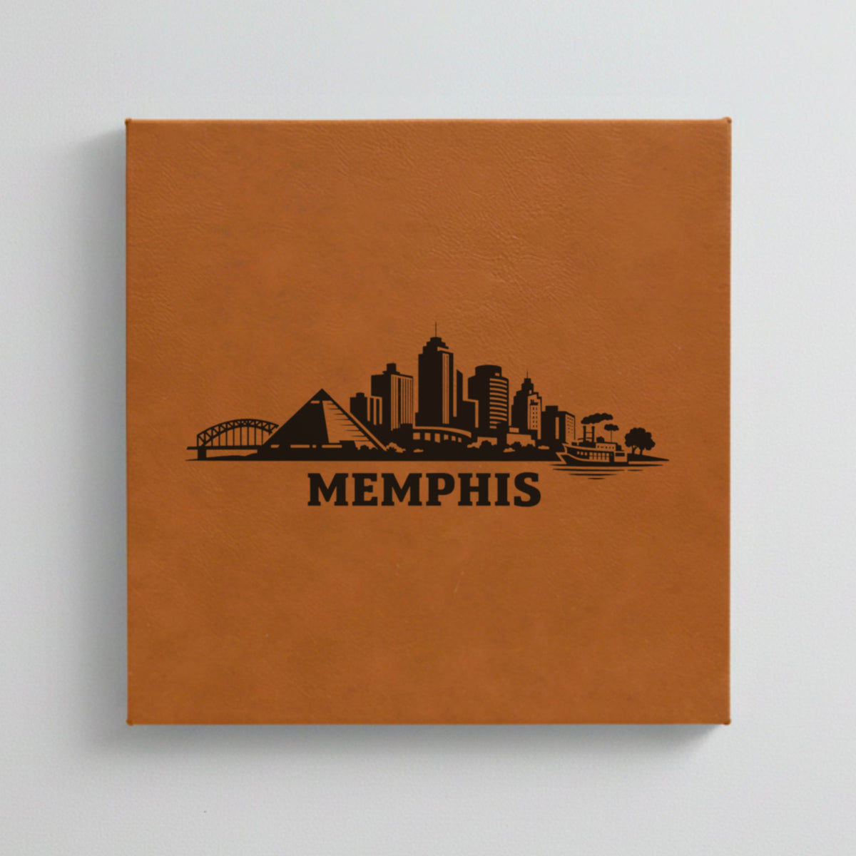 Close up of the Memphis, Tennessee skyline engraved on Brown leatherette