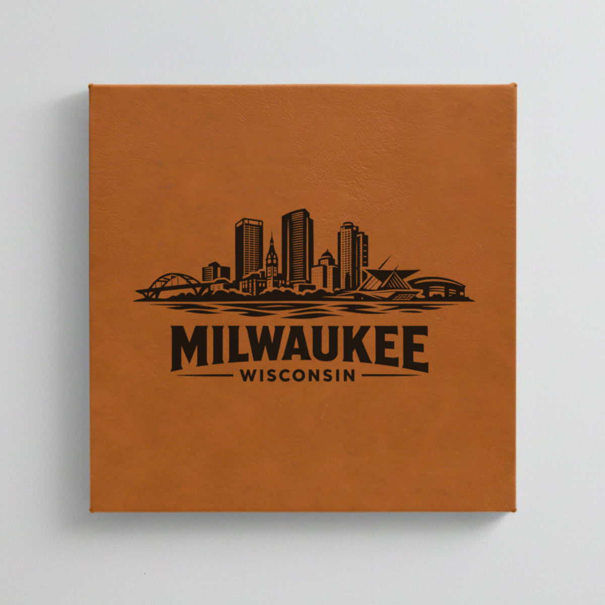 Close up of the Milwaukee, Wisconsin skyline engraved on Brown leatherette