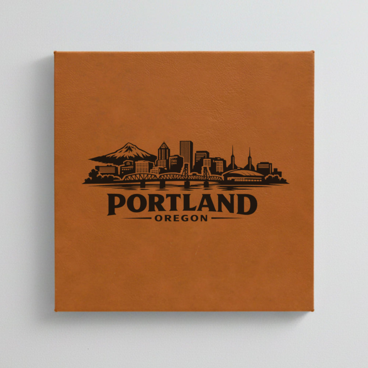 Close up of the Portland, Oregon skyline engraved on Brown leatherette