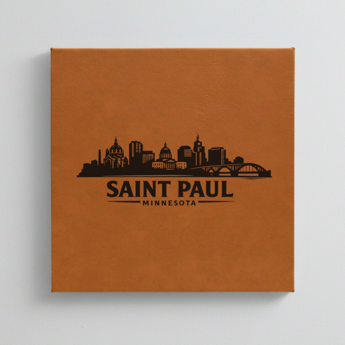 Close up of the Saint Paul, Minnesota skyline engraved on Brown leatherette