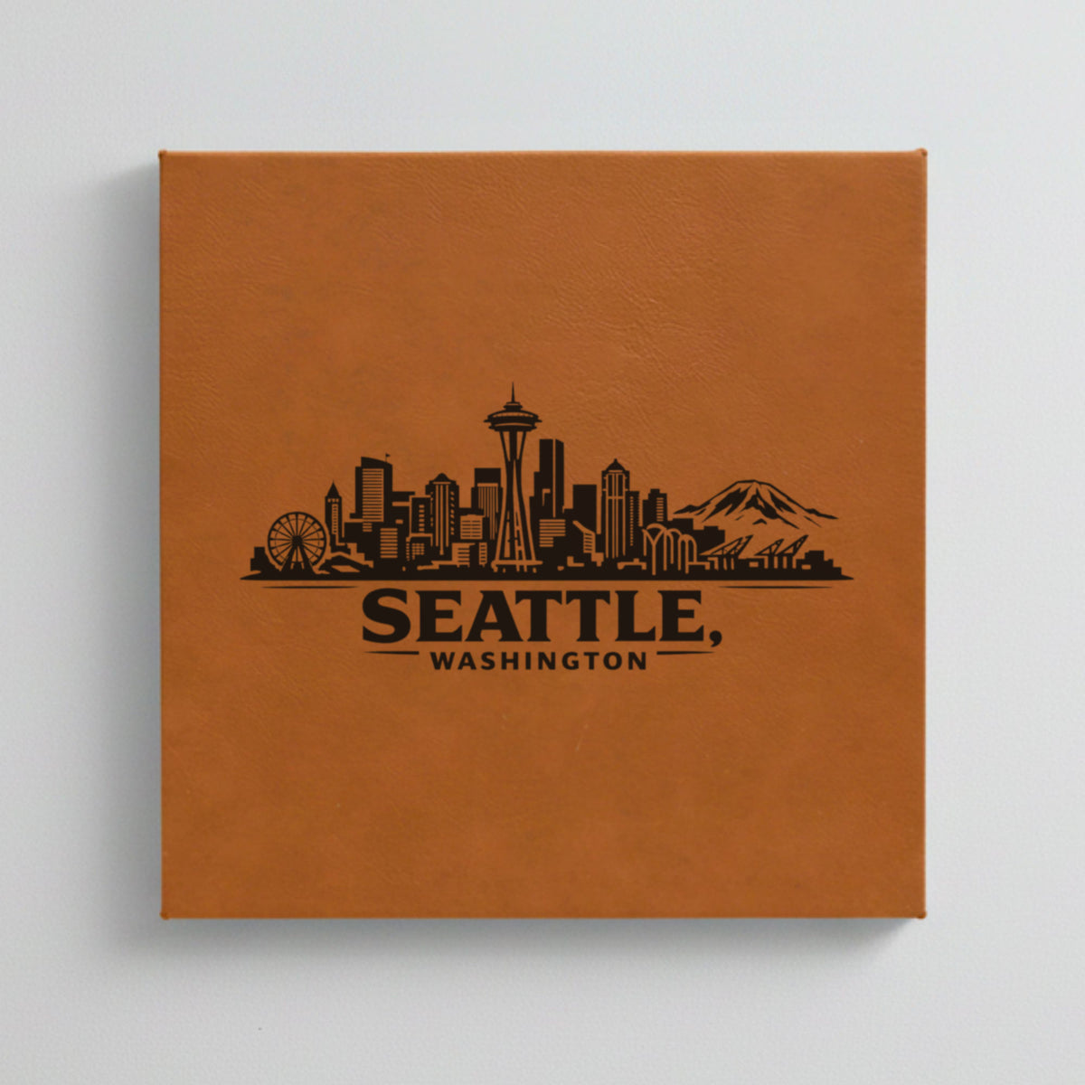 Close up of the Seattle, Washington skyline engraved on Brown leatherette