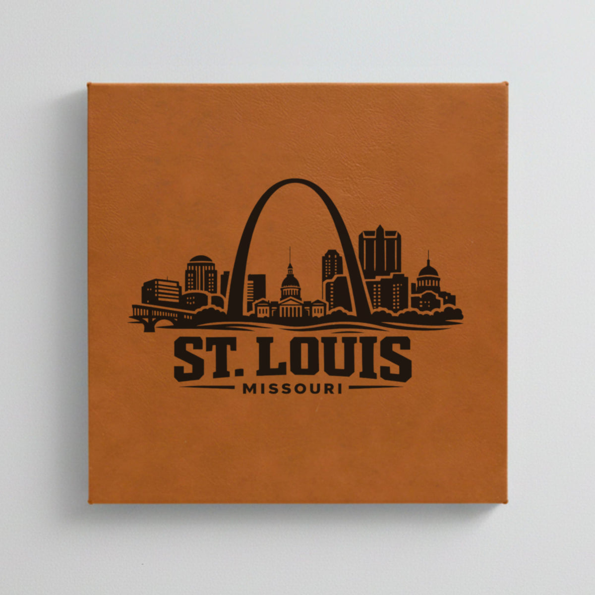 Close up of the St. Louis, Missouri skyline engraved on Brown leatherette