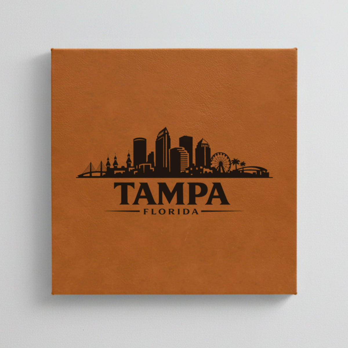 Close up of the Tampa, Florida skyline engraved on Brown leatherette