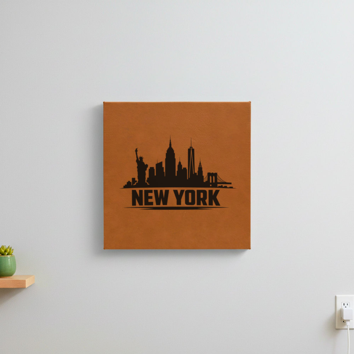 Brown leatherette wall sign engraved with the New York, New York skyline, hanging on a wall