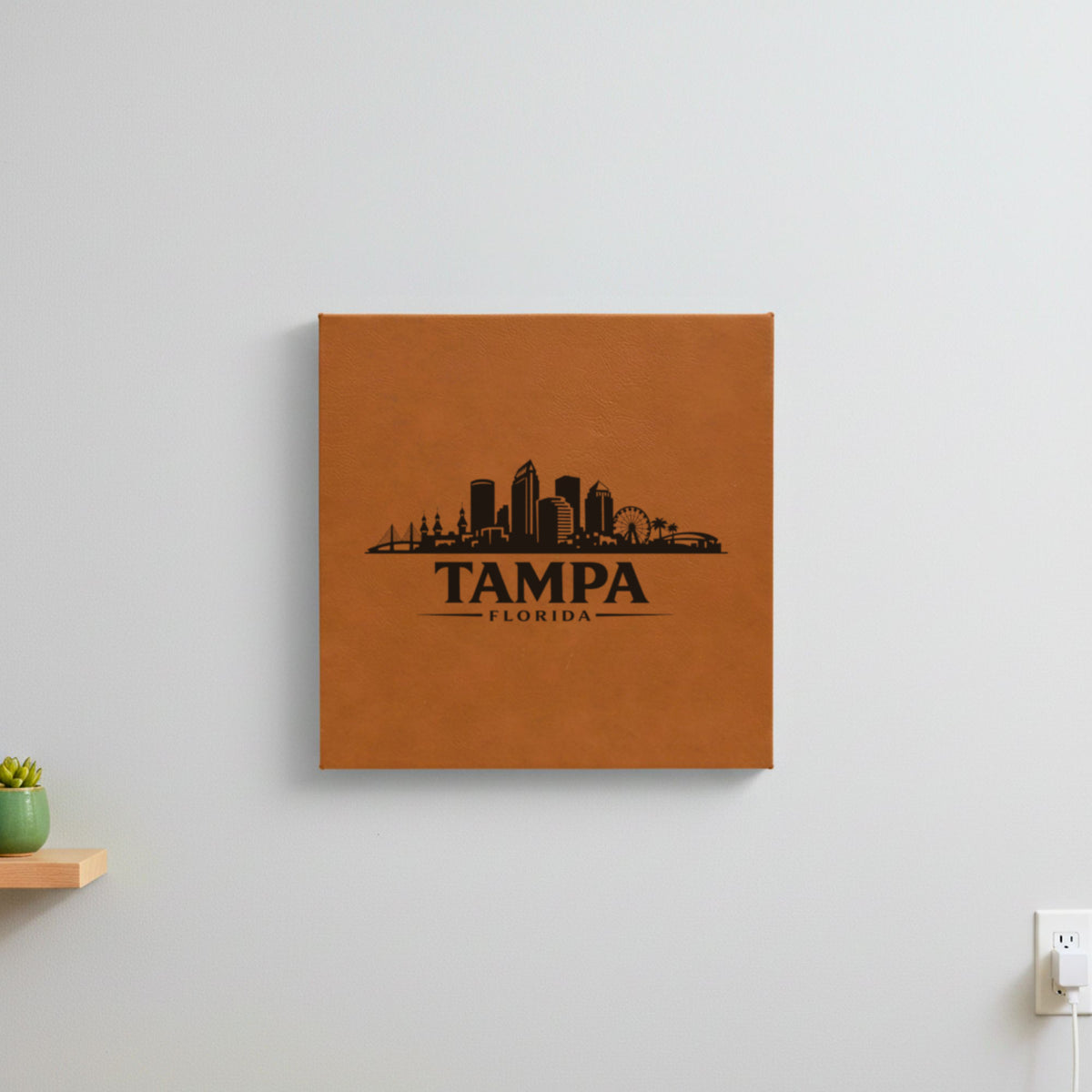 Brown leatherette wall sign engraved with the Tampa, Florida skyline, hanging on a wall