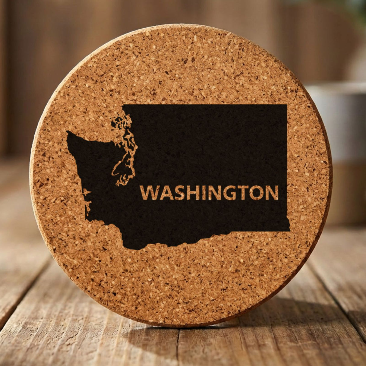 Washington round cork coaster engraved with the state shape and WASHINGTON in bold lettering