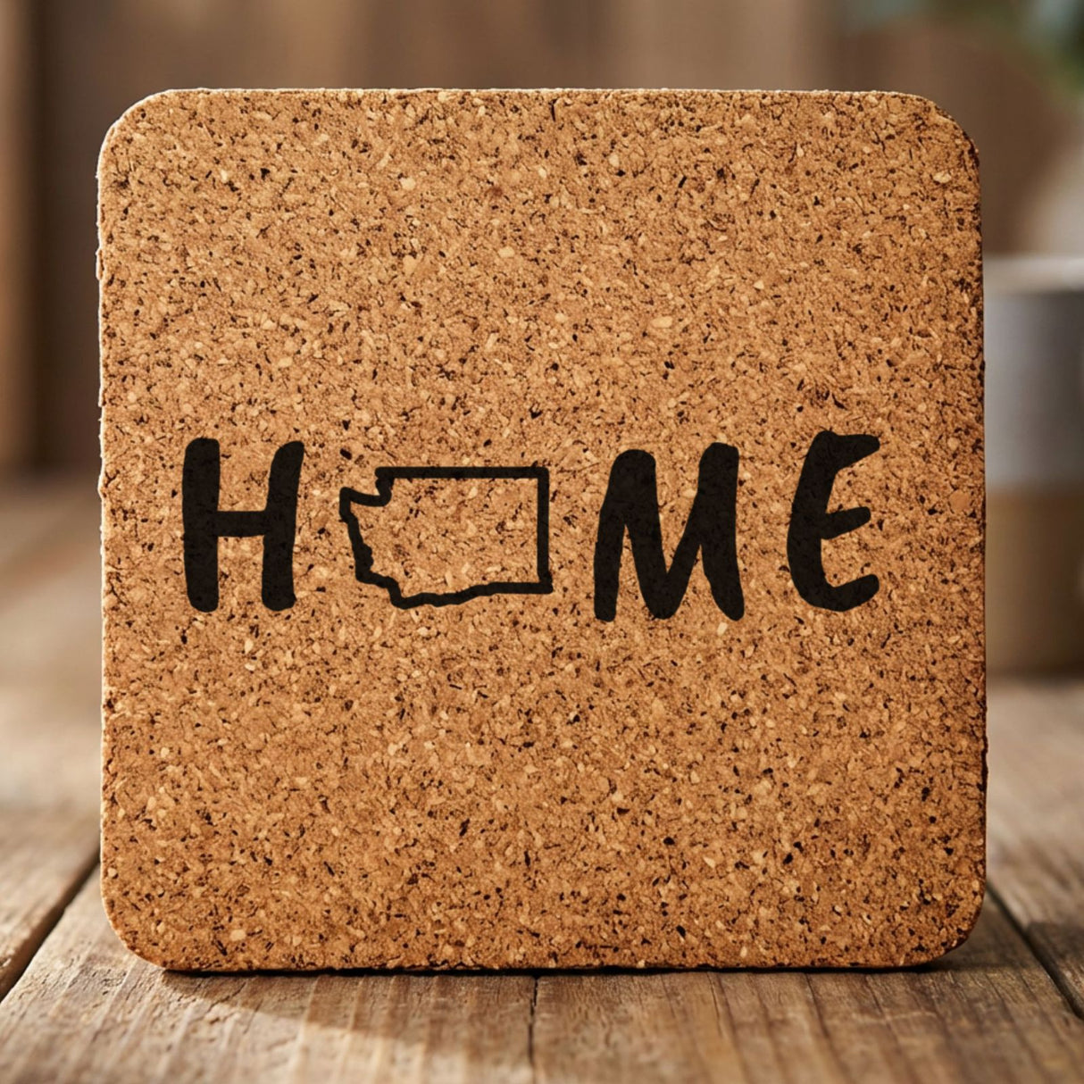 Washington square cork coaster engraved with HOME using the state outline as the letter O