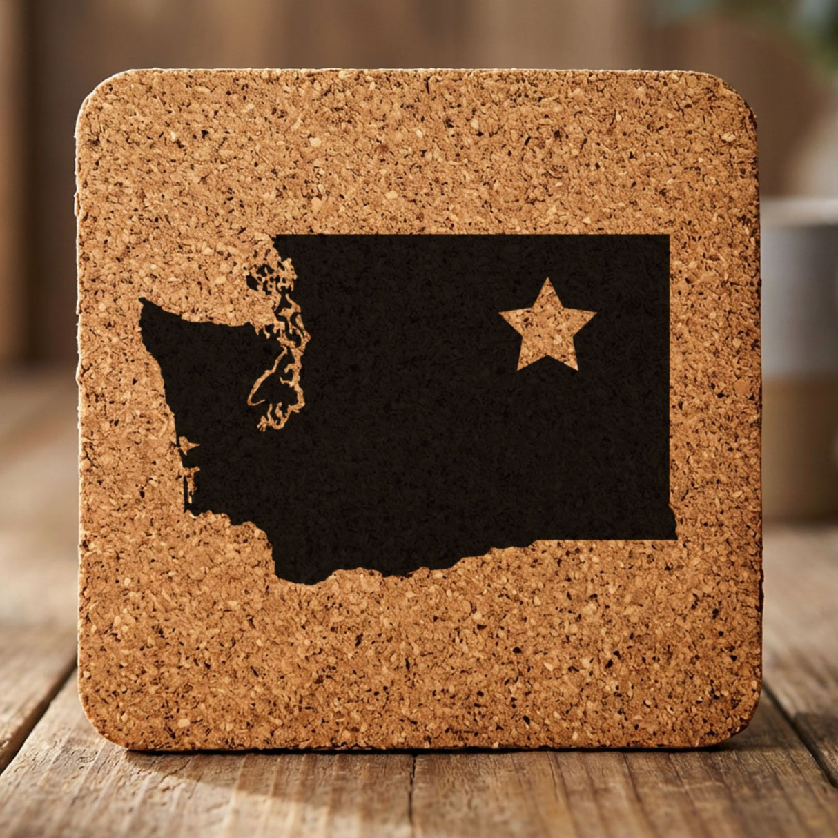 Washington square cork coaster engraved with the state shape and a star