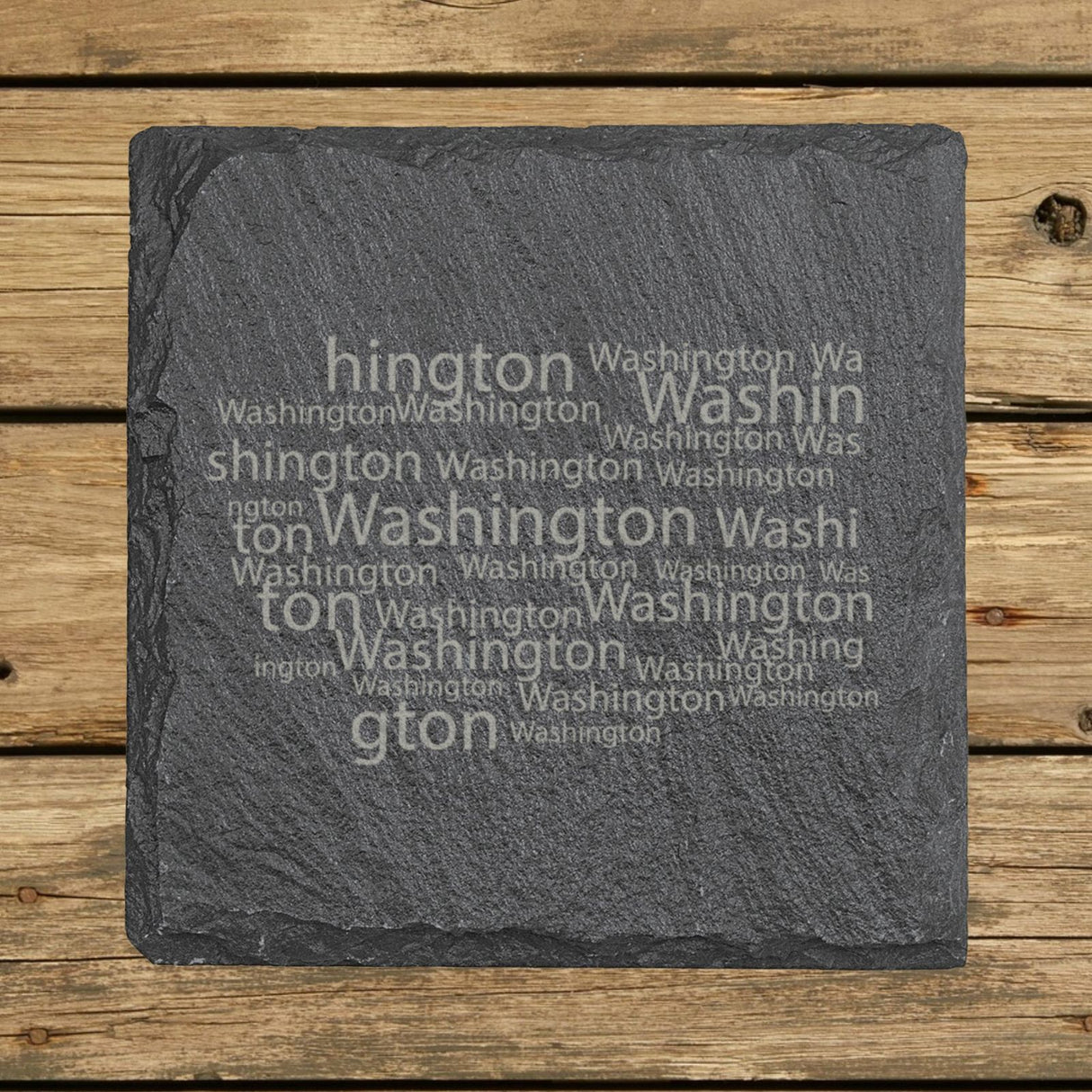 Washington square slate coaster engraved with a word cloud of repeating Washington text