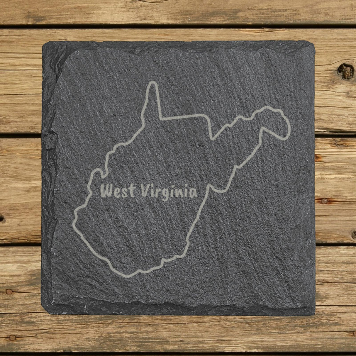 West Virginia square slate coaster engraved with the state outline and WEST VIRGINIA in hand-drawn brush lettering