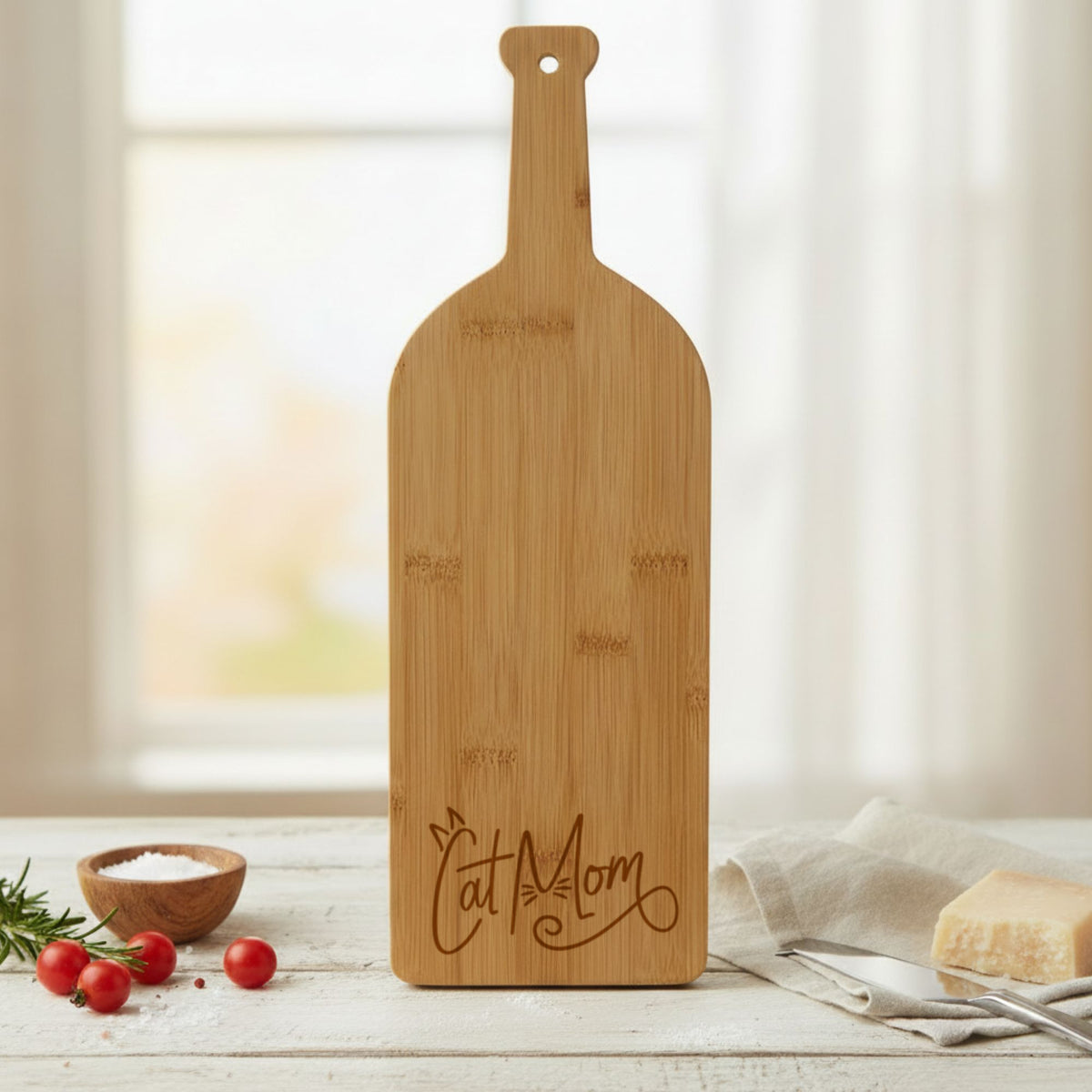 Bamboo wine bottle shaped cutting board laser engraved with "Cat Mom"