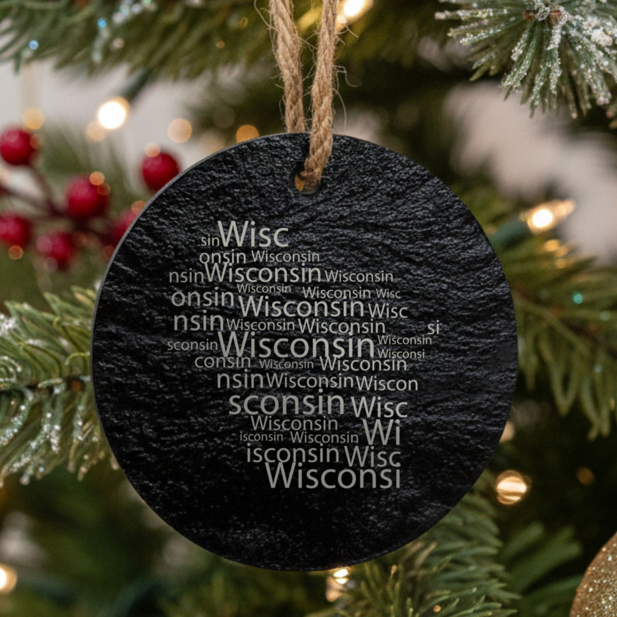 Wisconsin round slate Christmas ornament engraved with a word cloud of repeating Wisconsin text