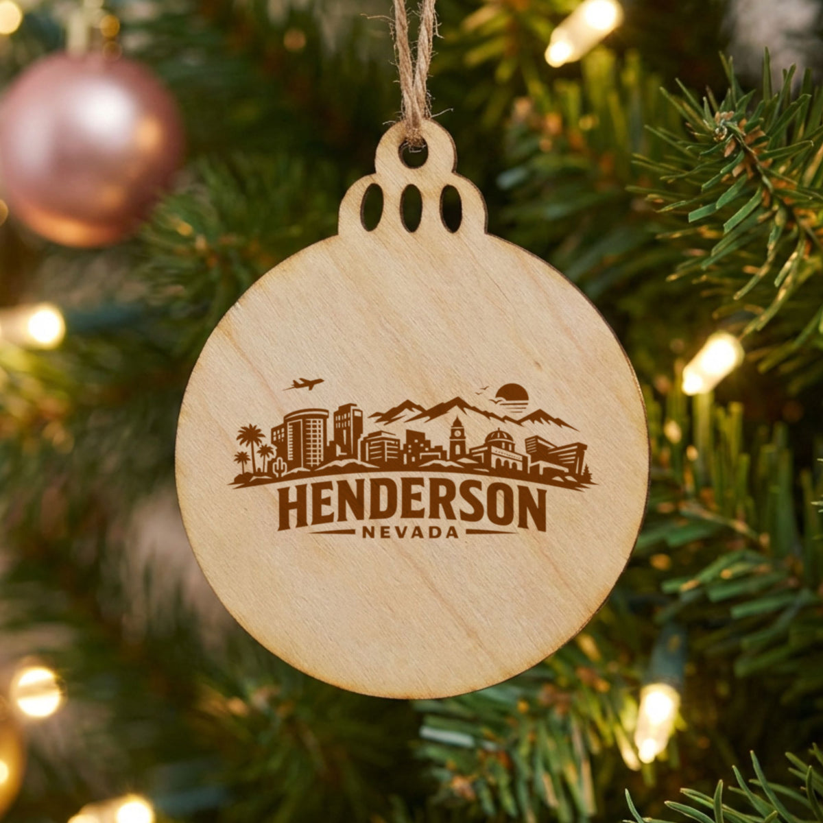 Henderson, Nevada skyline engraved on a round wood Christmas ornament
