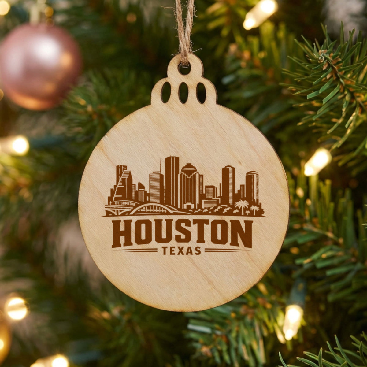 Houston, Texas skyline engraved on a round wood Christmas ornament