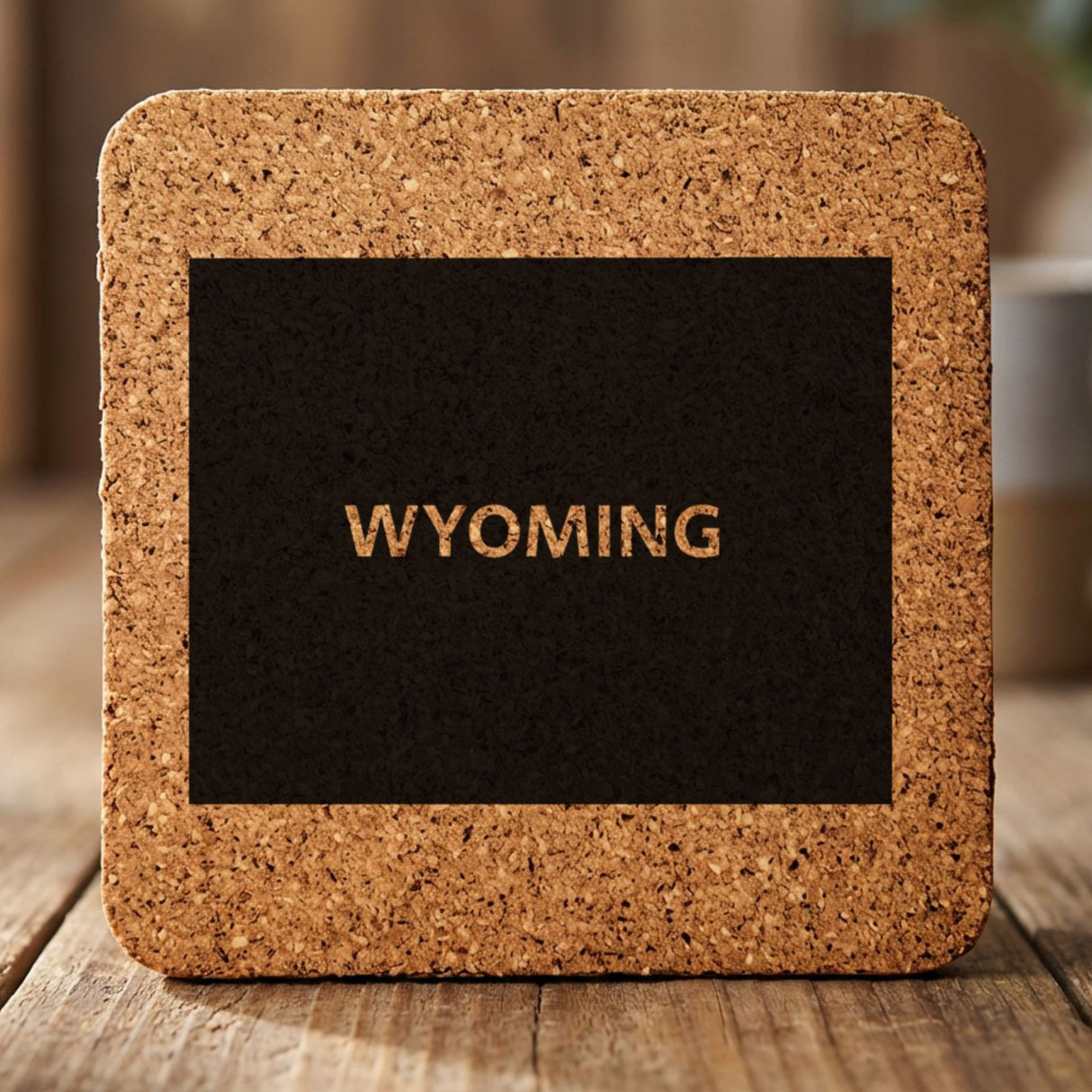 Wyoming square cork coaster engraved with the state shape and WYOMING in bold lettering