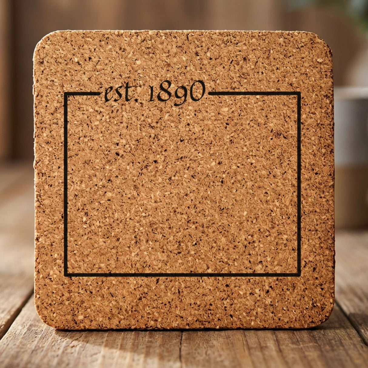 Wyoming square cork coaster engraved with the state outline and est. 1890