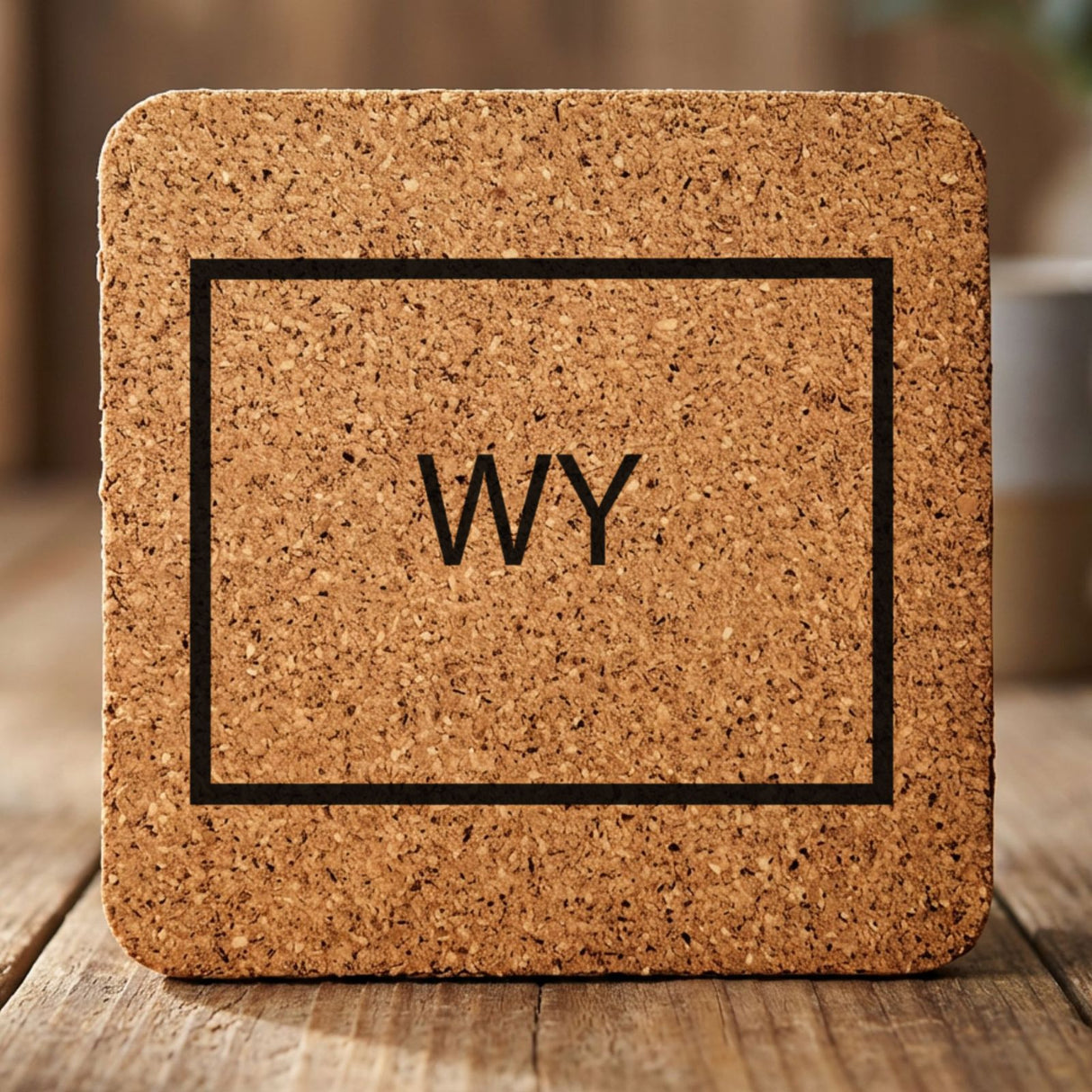 Wyoming square cork coaster engraved with the state outline and WY initials