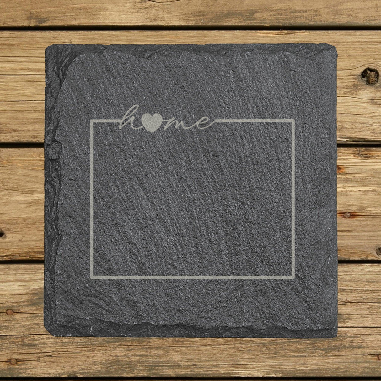 Wyoming square slate coaster engraved with the state outline and home in script with a heart