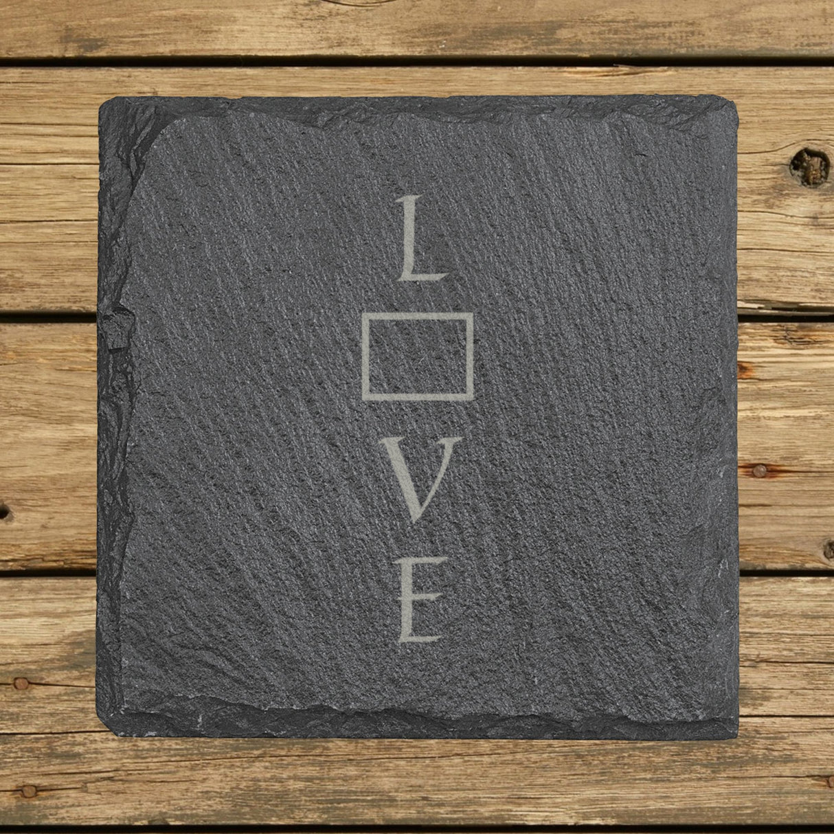 Wyoming square slate coaster engraved with LOVE stacked vertically using the state as the letter O