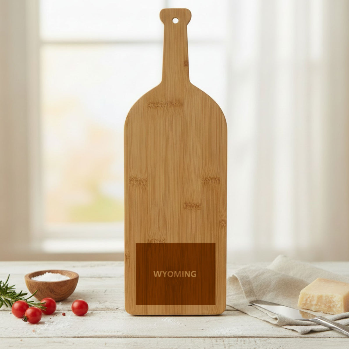 Bamboo wine bottle cutting board engraved with the Wyoming Bold State Name design