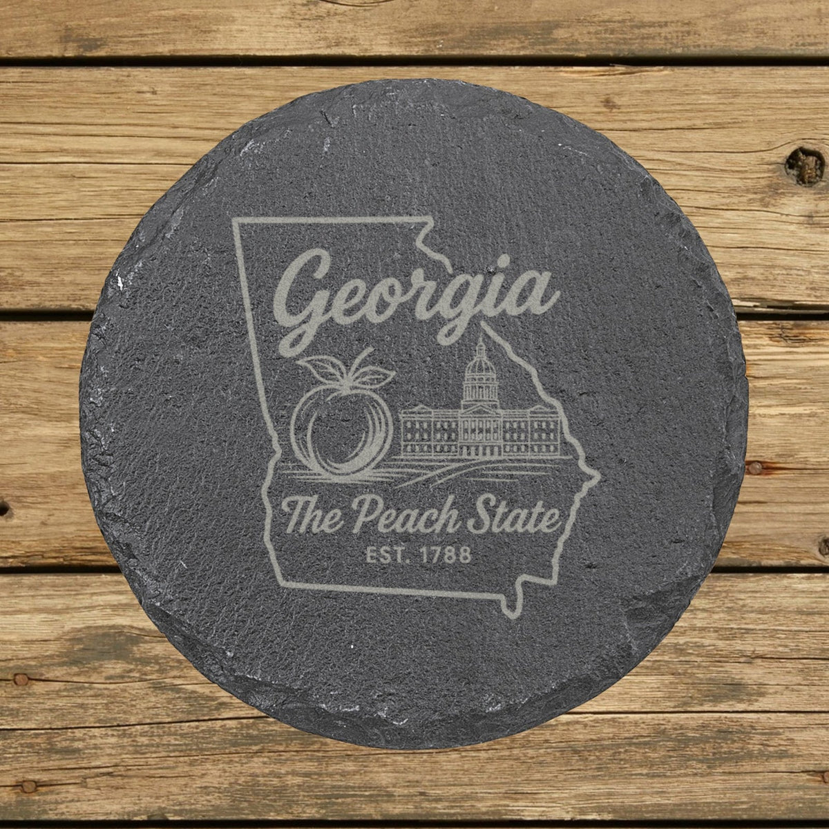 Georgia round slate coaster engraved with the state outline, a peach and the capitol dome, The Peach State