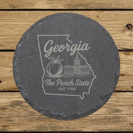 Georgia round slate coaster engraved with the state outline, a peach and the capitol dome, The Peach State