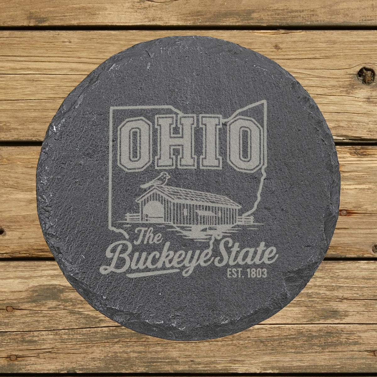 Ohio round slate coaster engraved with the state outline, a covered bridge and a cardinal, The Buckeye State