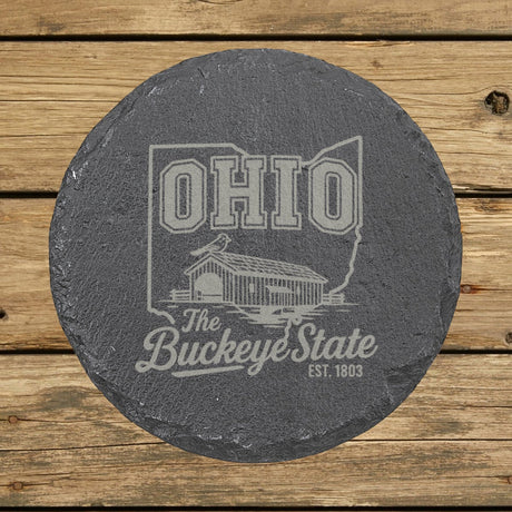 Ohio round slate coaster engraved with the state outline, a covered bridge and a cardinal, The Buckeye State
