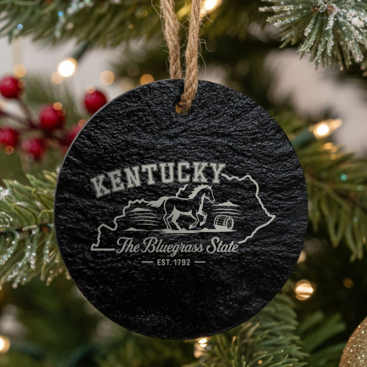 Round slate Christmas ornament laser engraved with a Kentucky design of a galloping horse and a bourbon barrel