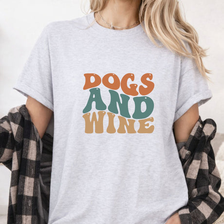 women standing wearing a grey wine shirt that says dogs and wine 