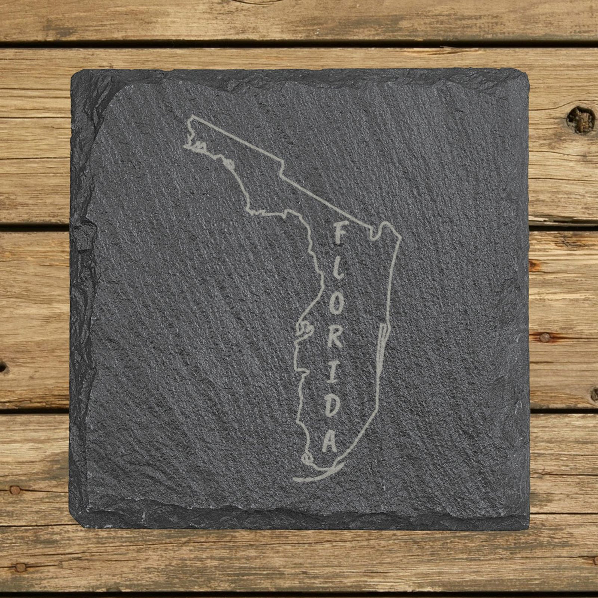 Florida square slate coaster engraved with the state outline and FLORIDA running vertically