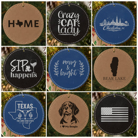 Nine round engraved leatherette ornaments in brown, black and blue with designs like Home, Crazy Cat Lady and Sip Happens