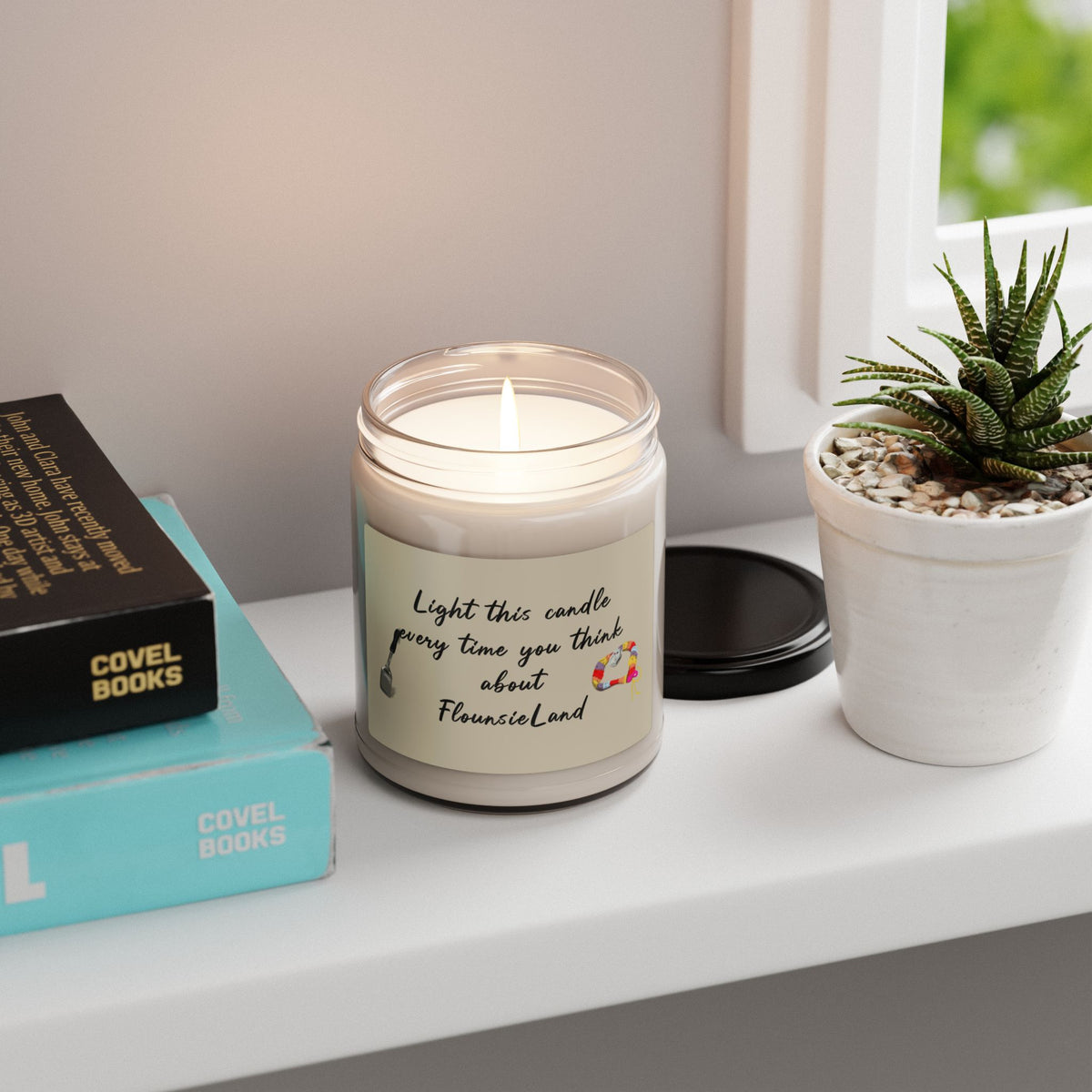FlounsieLand scented soy candle, 9 oz glass jar with the hand drawn FlounsieLand design by Nina Leipold