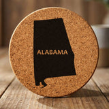 Alabama round cork coaster engraved with the state shape and ALABAMA in bold lettering