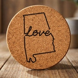 Alabama round cork coaster engraved with a hand-drawn state outline and love in cursive