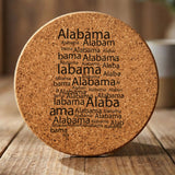 Alabama round cork coaster engraved with a word cloud of repeating Alabama text