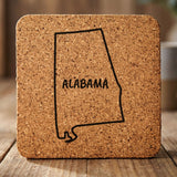 Alabama square cork coaster engraved with the state outline and ALABAMA in hand-drawn brush lettering
