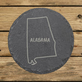 Alabama round slate coaster engraved with the state outline and ALABAMA in hand-drawn brush lettering