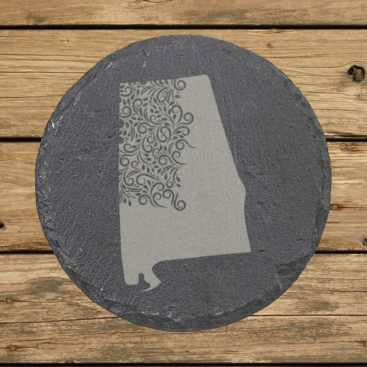 Alabama round slate coaster engraved with the state shape in ornate floral scrollwork
