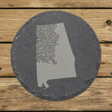 Alabama round slate coaster engraved with the state shape in ornate floral scrollwork