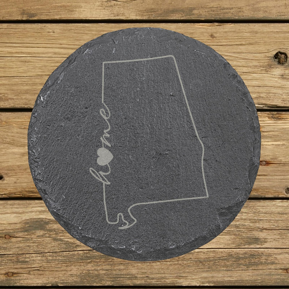 Alabama round slate coaster engraved with the state outline and home in script with a heart