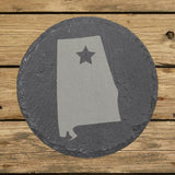 Alabama round slate coaster engraved with the state shape and a star