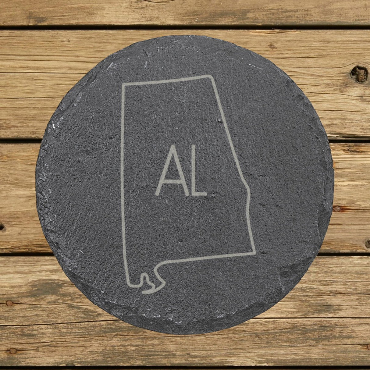 Alabama round slate coaster engraved with the state outline and AL initials