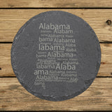 Alabama round slate coaster engraved with a word cloud of repeating Alabama text