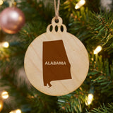 Alabama round wood Christmas ornament engraved with the state shape and ALABAMA in bold lettering
