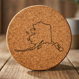 Alaska round cork coaster engraved with a clean state outline